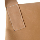 Studiofoto laptas cognac riem